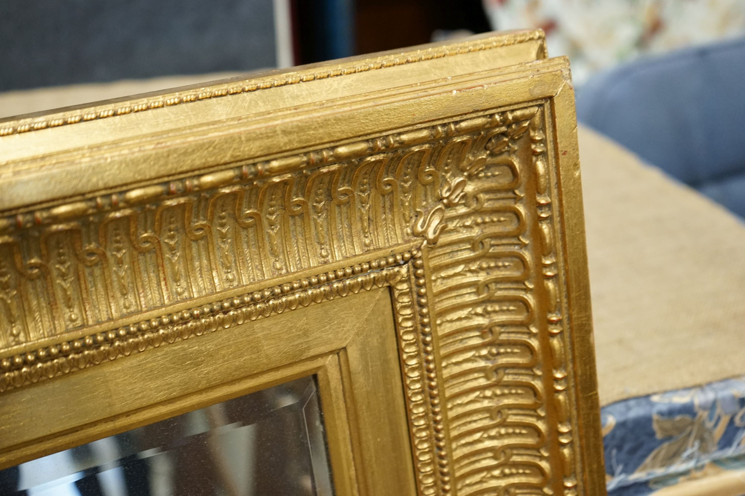 A large reproduction Victorian style gilt framed wall mirror, width 150cm, height 124cm